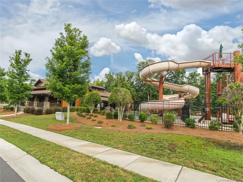 233 Annatto Way, Unit 553 Tega Cay, SC 29708 - Photo 20 of 22 a view of a yard with plants and trees