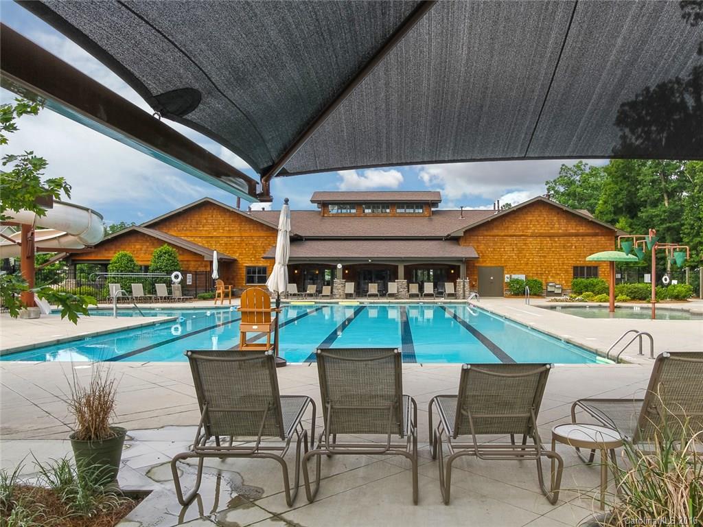 233 Annatto Way, Unit 553 Tega Cay, SC 29708 - Photo 21 of 22 a patio with a table and chairs