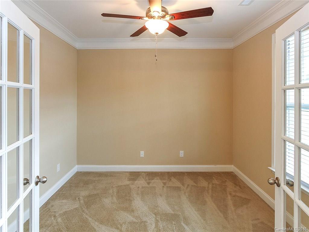 233 Annatto Way, Unit 553 Tega Cay, SC 29708 - Photo 7 of 22 an empty room with windows and fan