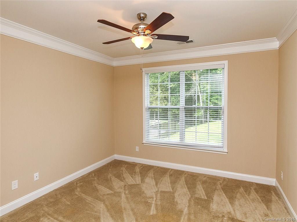233 Annatto Way, Unit 553 Tega Cay, SC 29708 - Photo 10 of 22 an empty room with a window and a ceiling fan