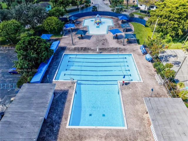 a view of a backyard with sitting area