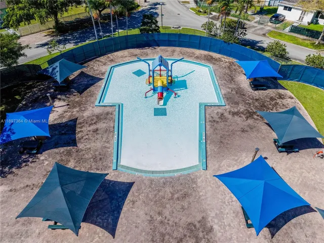 an aerial view of a house swimming pool and outdoor space