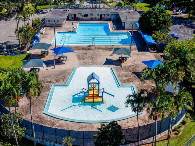 an aerial view of a house with swimming pool