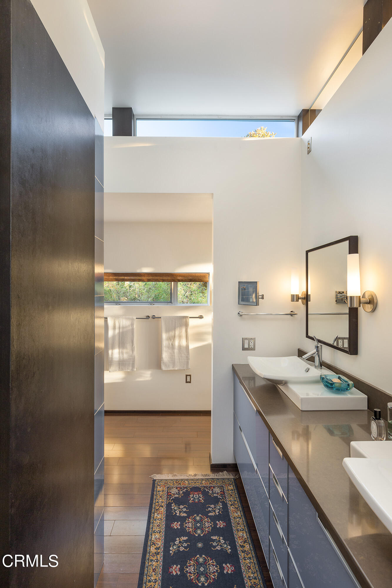 1869 Kaweah Drive Pasadena, CA 91105 - Photo 23 of 36 a bathroom with a double vanity sink and mirror