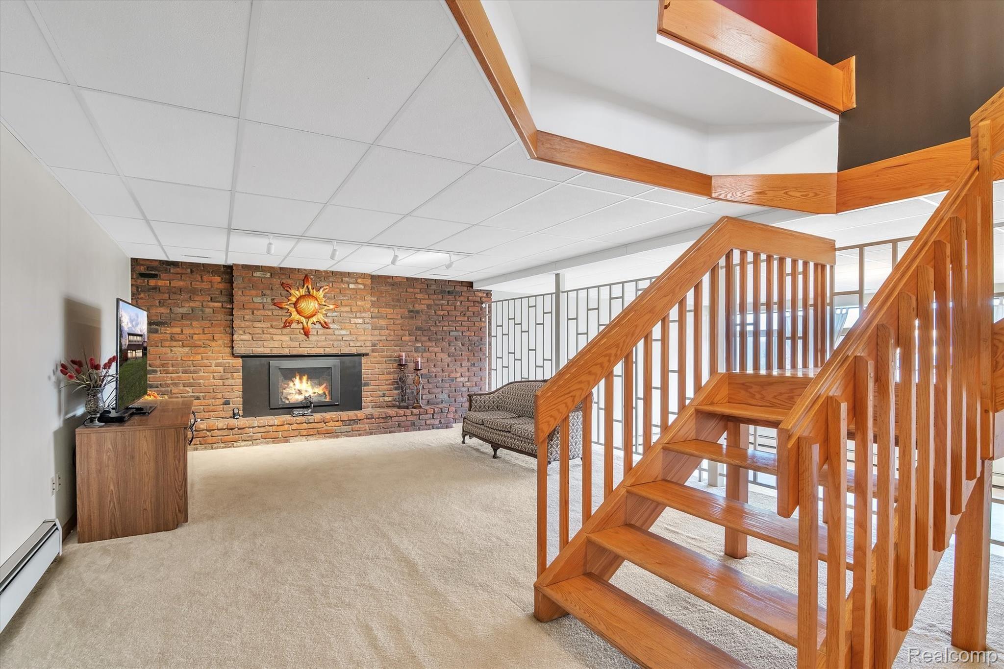 4211 Crandall Road Howell, MI 48855 - Photo 11 of 42 Cozy Fireplace in Open Family Room