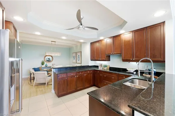 a kitchen with a sink cabinets and window