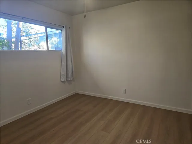 a view of an empty room and a window