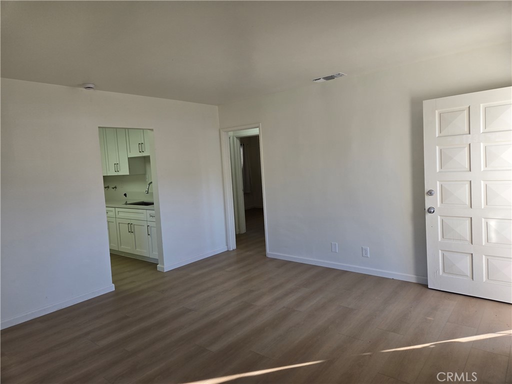 1734 Atchison Street Pasadena, CA 91104 - Photo 5 of 19 an empty room with wooden floor and closet