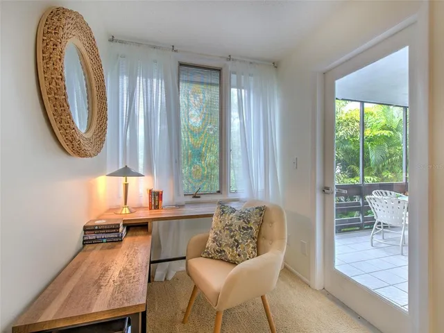 a blue bench sitting in front of a window
