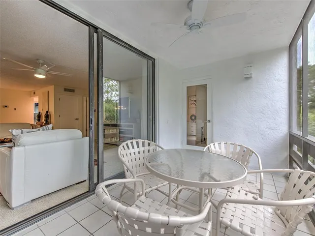 a view of a chairs and table in a patio