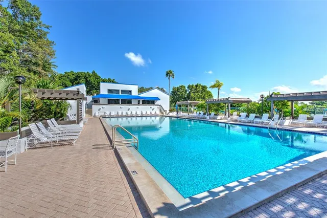 a view of a swimming pool with a patio