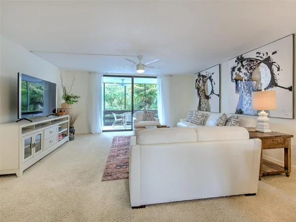a living room with furniture and a rug