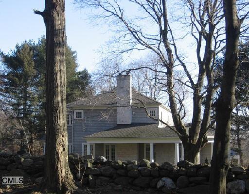 21 North Racebrook Road Woodbridge, CT 06525 - Photo 1 of 1 a front view of a house with garden