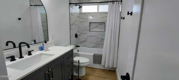 a view of outdoor dining space with a table and chairs