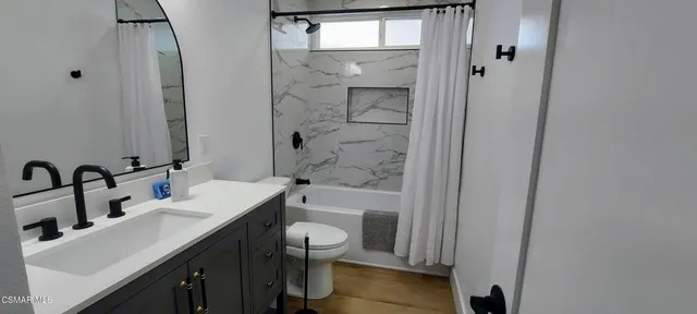 a view of outdoor dining space with a table and chairs