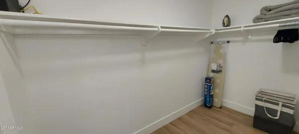 a bedroom with a bed and a chair