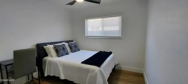 a view of workspace with wooden floor and windows