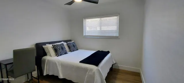 a view of workspace with wooden floor and windows