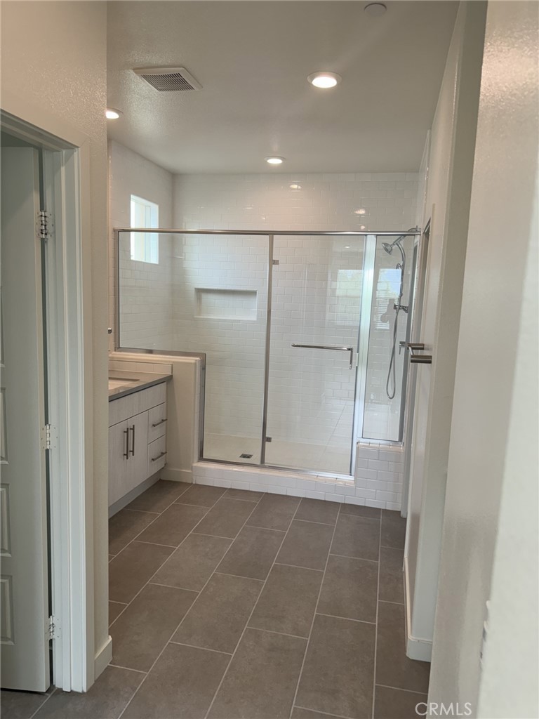 233 Radial Irvine, CA 92618 - Photo 12 of 27 a bathroom with a shower and a sink