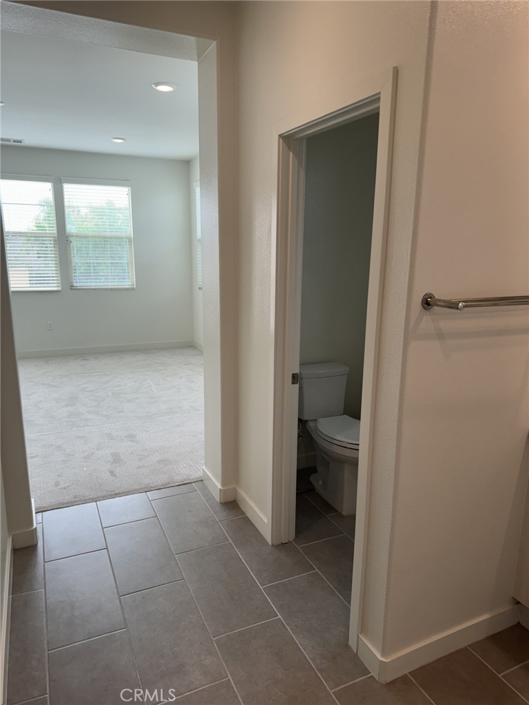 233 Radial Irvine, CA 92618 - Photo 14 of 27 a bathroom with a sink and a toilet