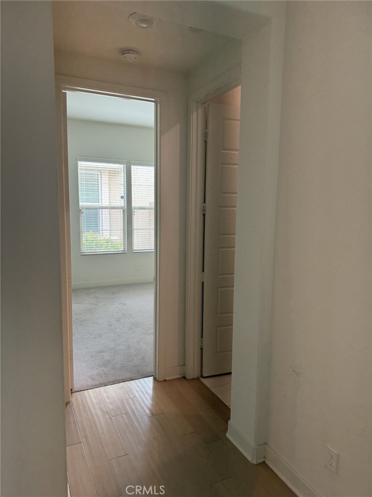 233 Radial Irvine, CA 92618 - Photo 21 of 27 an empty room that has a wooden door