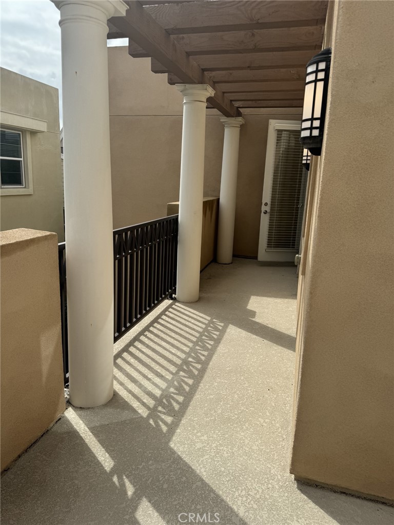 233 Radial Irvine, CA 92618 - Photo 23 of 27 a view of a hallway with wooden walls