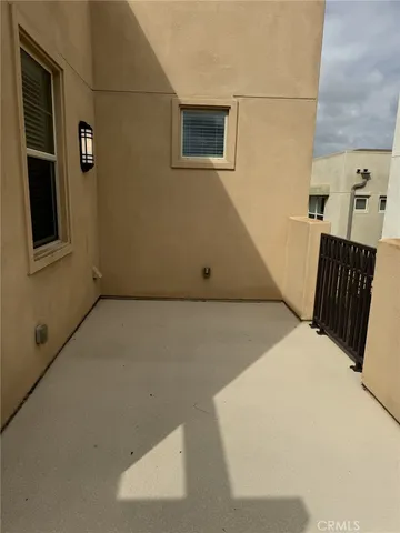 a view of an empty room with windows