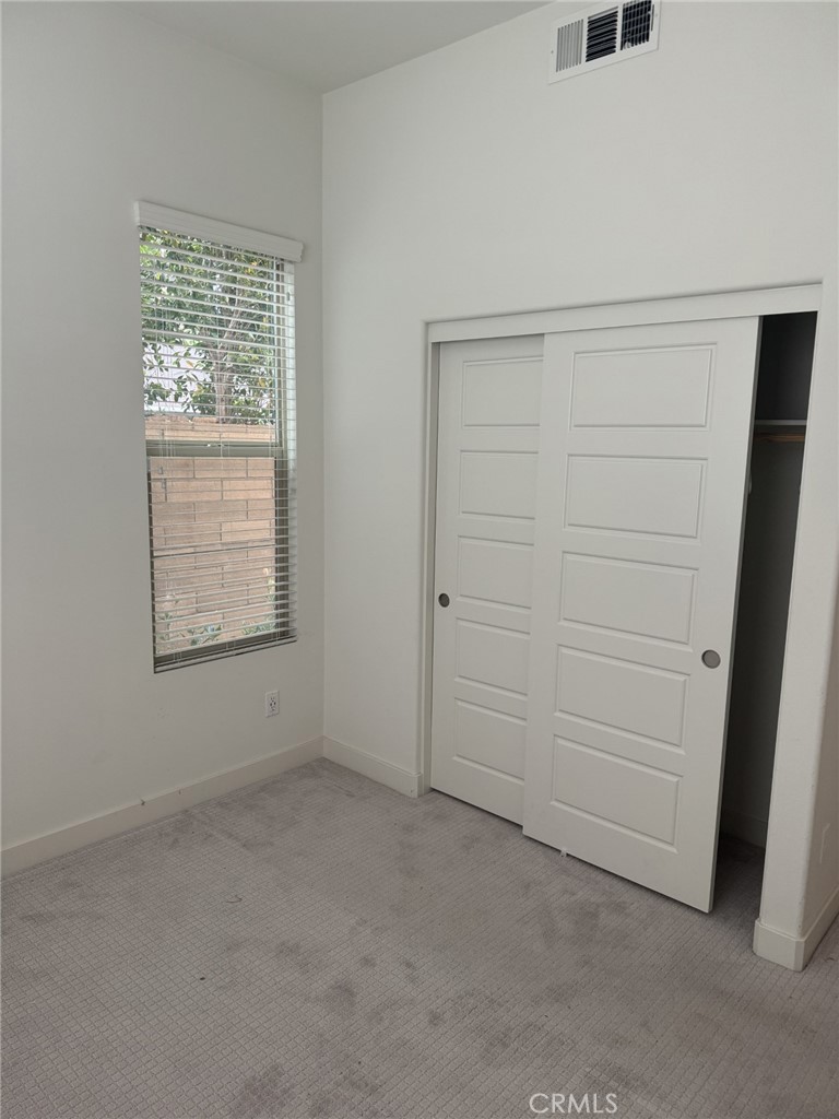 233 Radial Irvine, CA 92618 - Photo 9 of 27 an empty room with windows