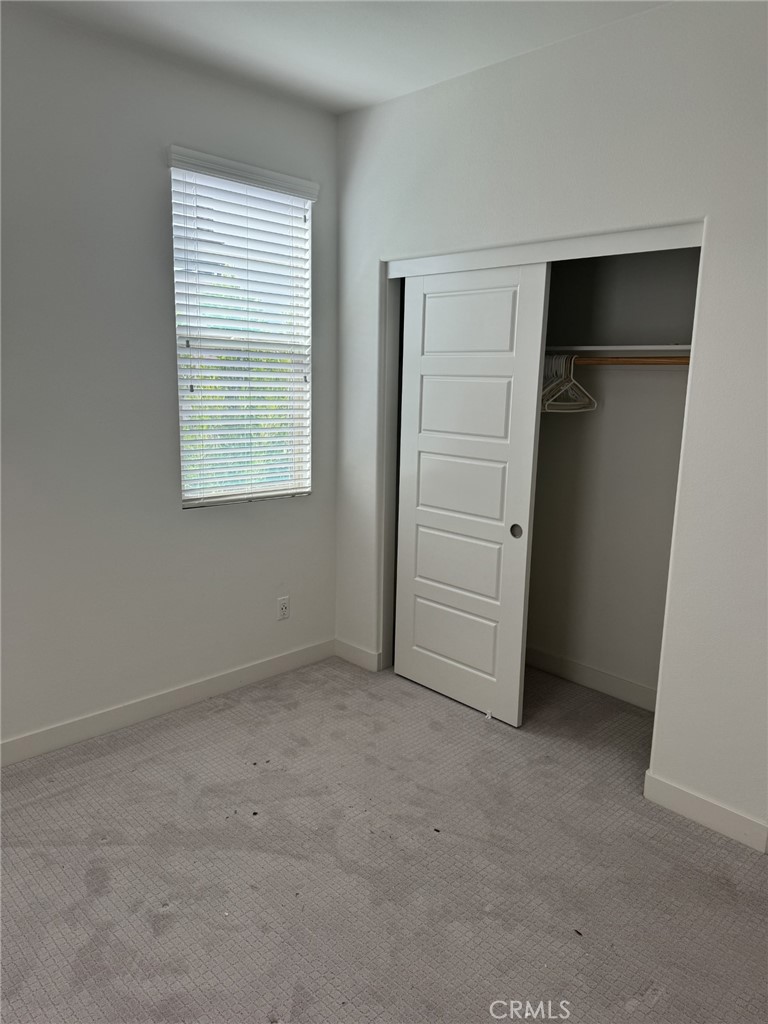233 Radial Irvine, CA 92618 - Photo 10 of 27 an empty room with closet and a window