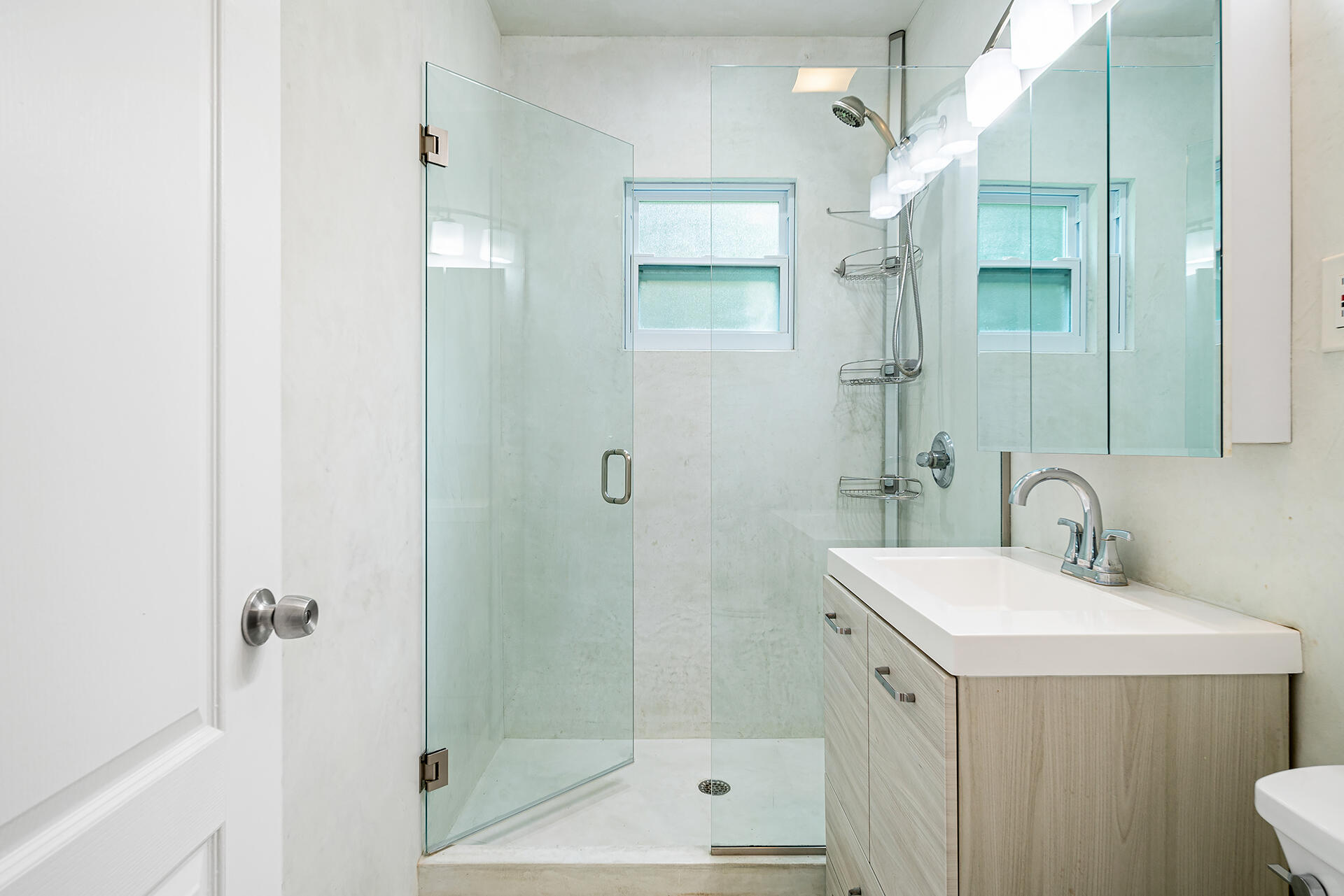 813 Avon Road West Palm Beach, FL 33401 - Photo 18 of 43 a bathroom with a sink a toilet and shower