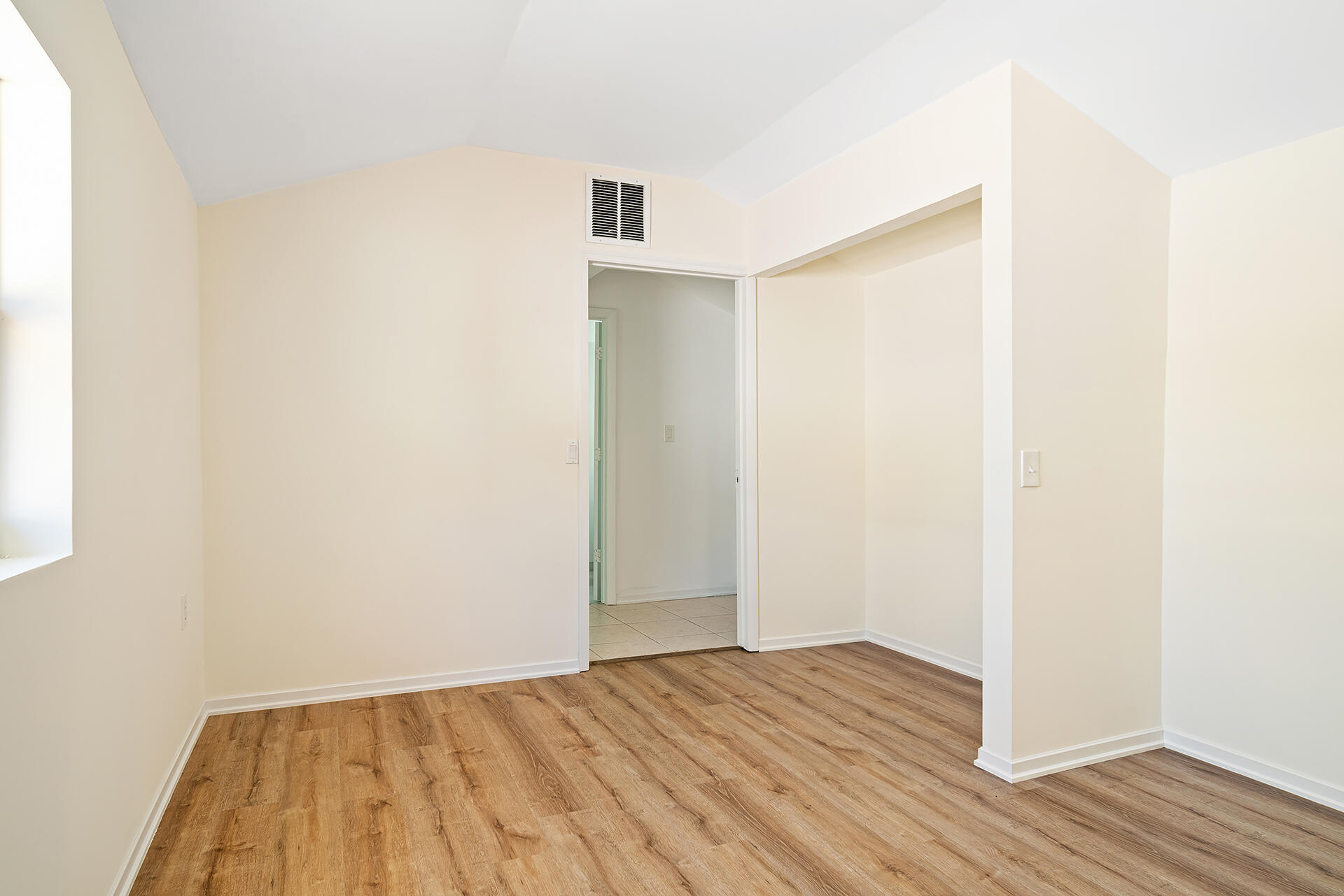 813 Avon Road West Palm Beach, FL 33401 - Photo 37 of 43 a view of an empty room with wooden floor