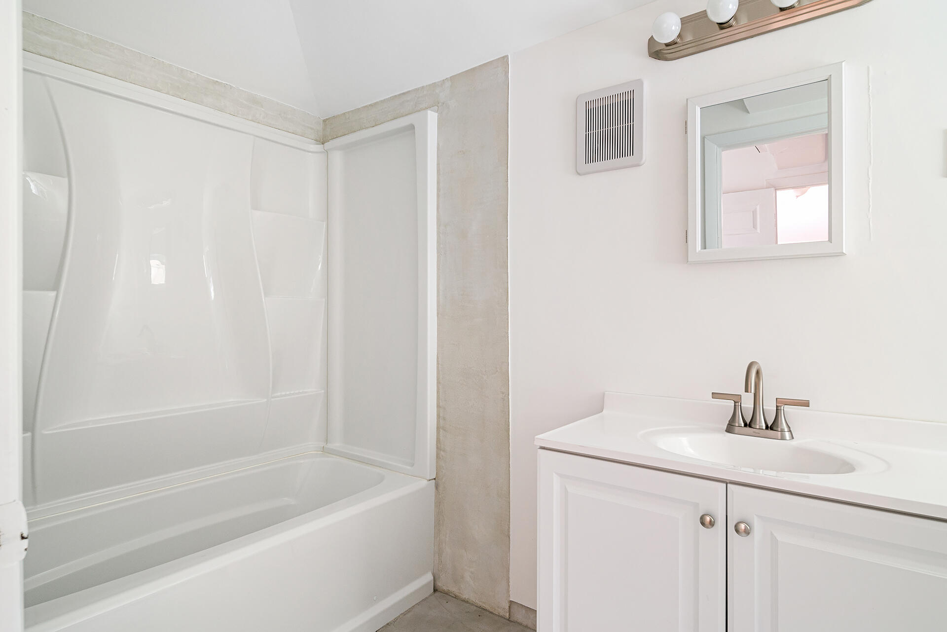 813 Avon Road West Palm Beach, FL 33401 - Photo 39 of 43 a white bath tub sitting next to a white sink