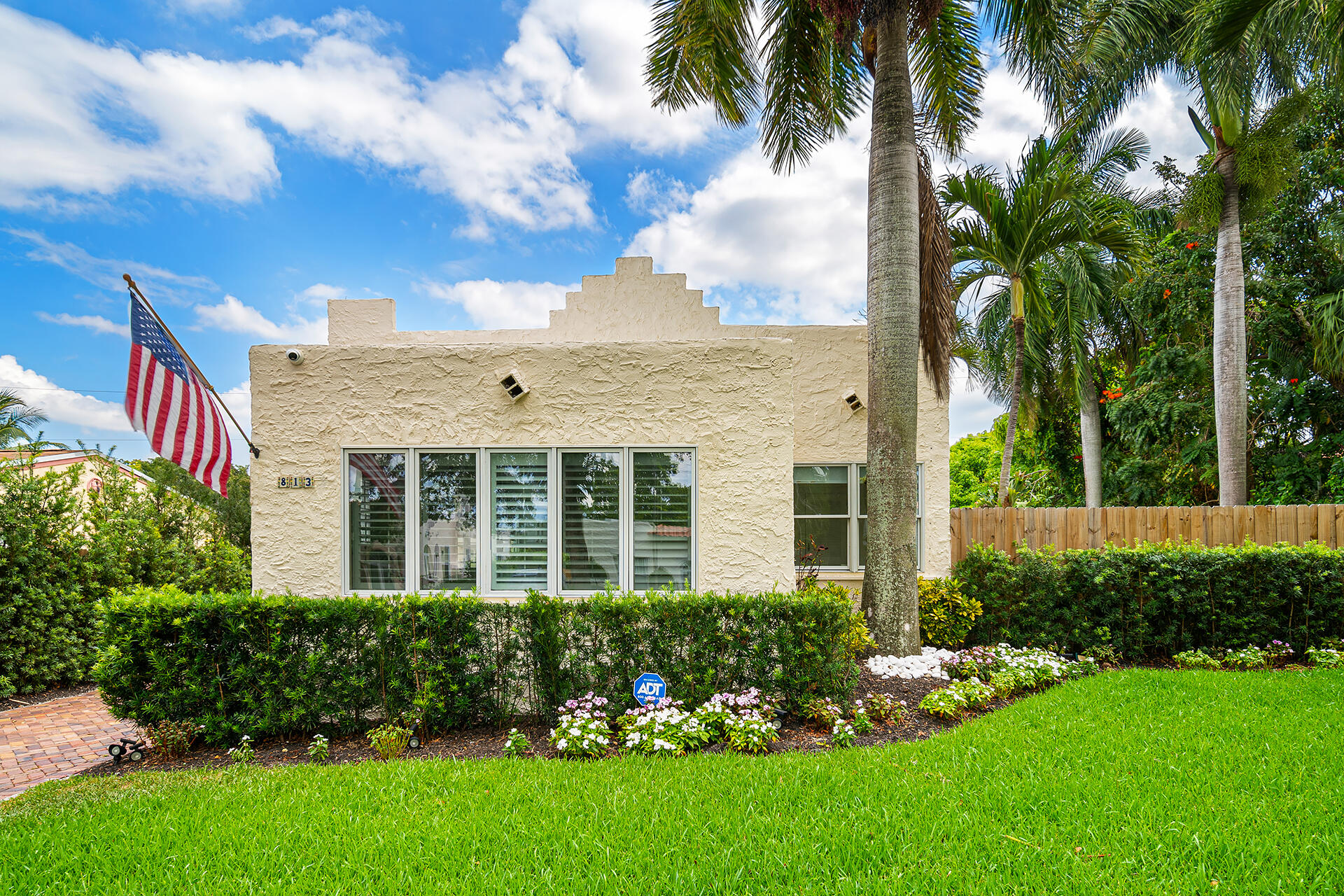 813 Avon Road West Palm Beach, FL 33401 - Photo 41 of 43 a front view of a house with a garden