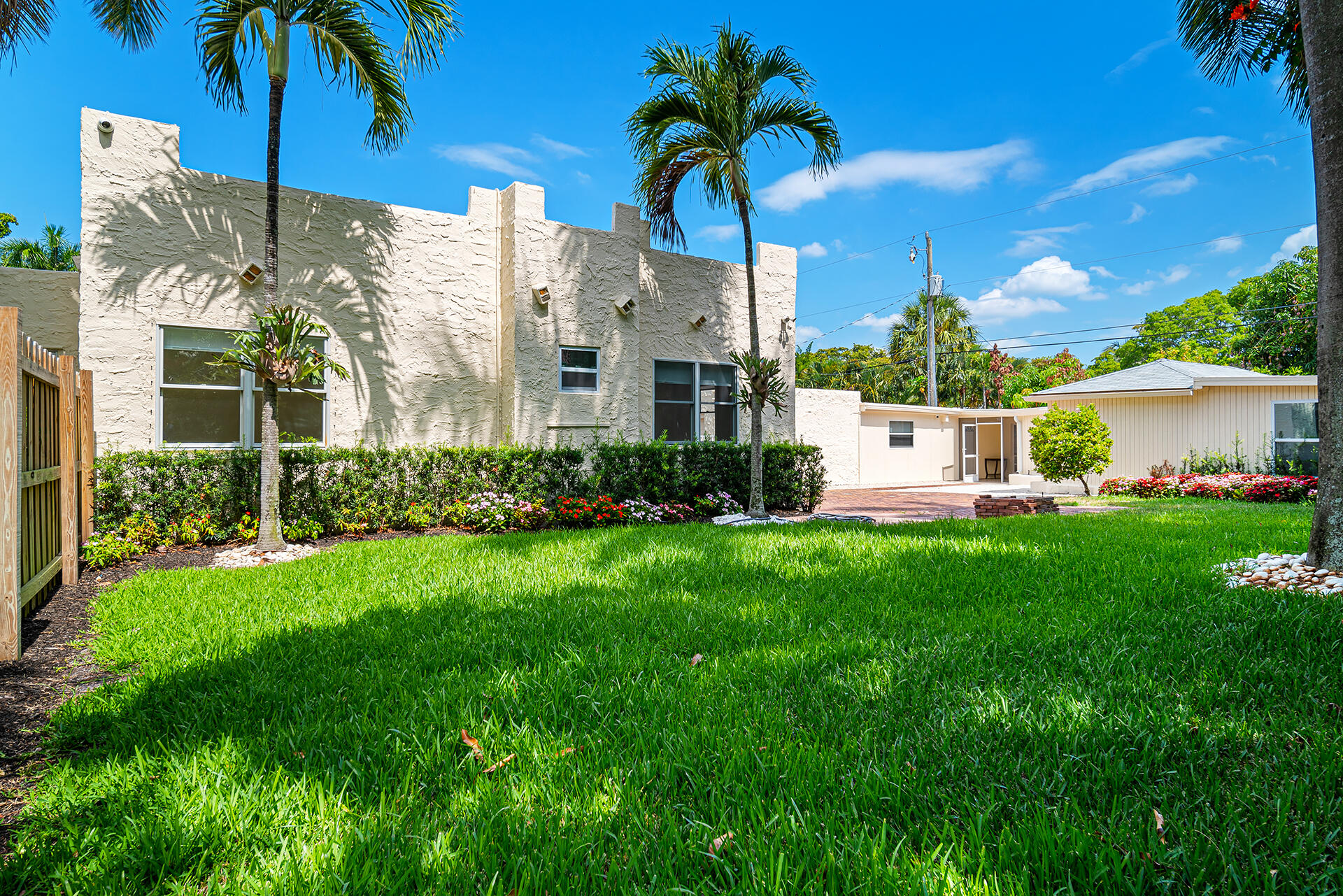813 Avon Road West Palm Beach, FL 33401 - Photo 42 of 43 a front view of a house with garden