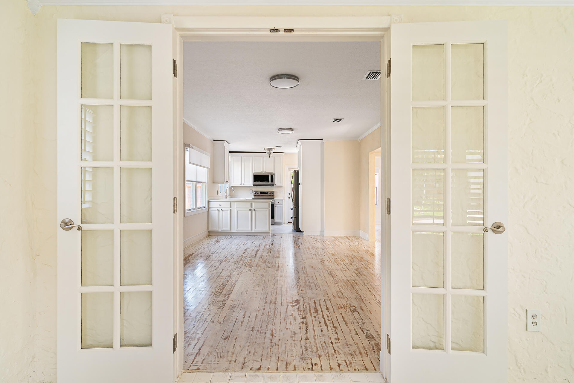 813 Avon Road West Palm Beach, FL 33401 - Photo 6 of 43 a view of a hallway with wooden floor and closet area
