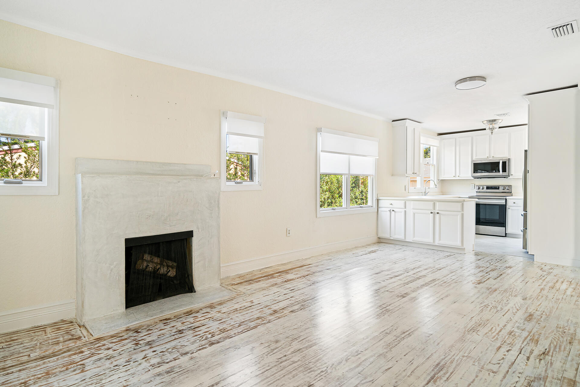 813 Avon Road West Palm Beach, FL 33401 - Photo 7 of 43 a view of a kitchen with a stove cabinets and wooden floor