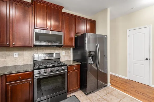a view of balcony with wooden floor and fence
