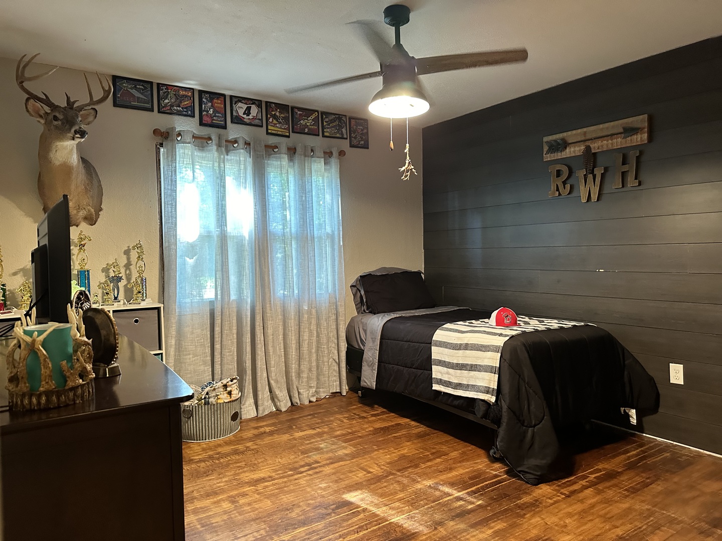 10600 Osage Road Prophetstown, IL 61277 - Photo 14 of 17 a bedroom with a bed and a chandelier