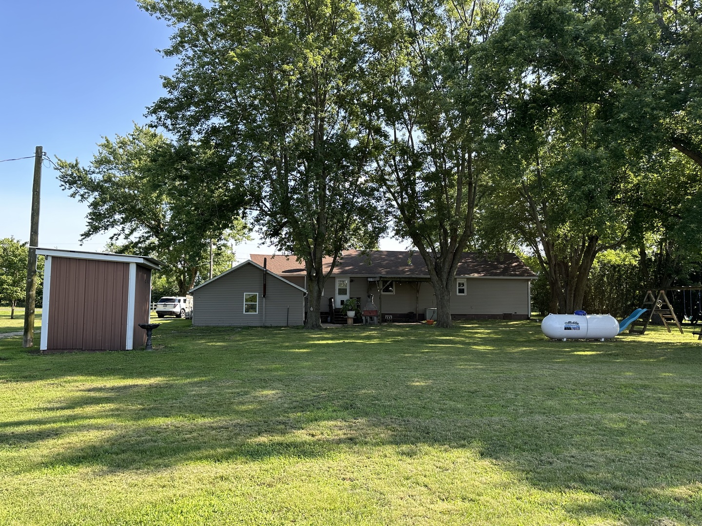 10600 Osage Road Prophetstown, IL 61277 - Photo 2 of 17 a view of a house with a yard