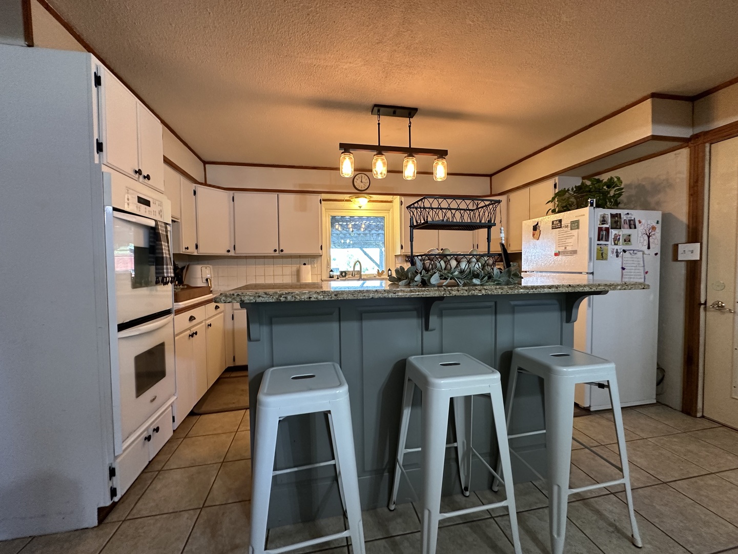 10600 Osage Road Prophetstown, IL 61277 - Photo 4 of 17 a kitchen with stainless steel appliances a white stove top oven and cabinets