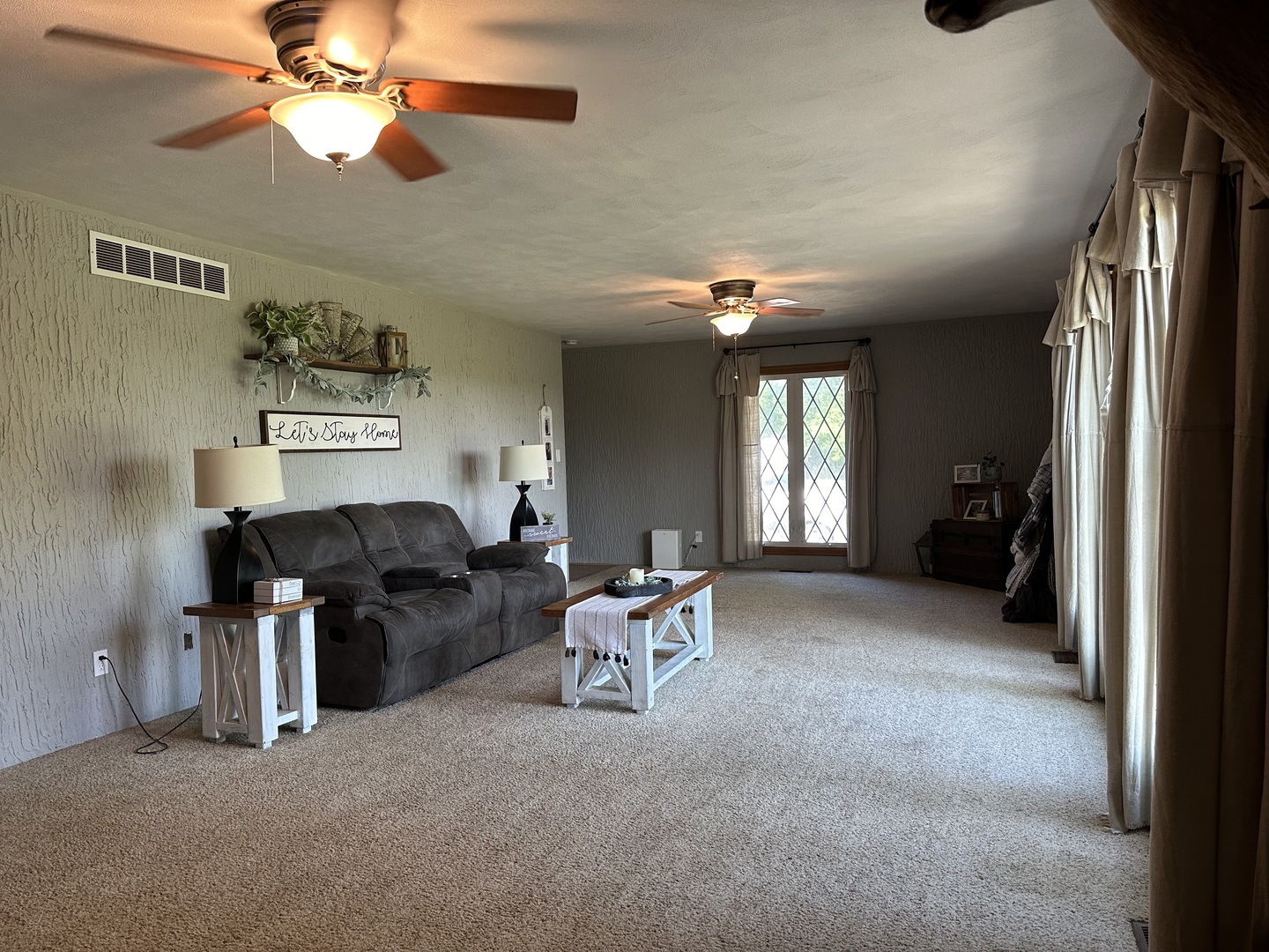 10600 Osage Road Prophetstown, IL 61277 - Photo 6 of 17 a living room with furniture and a chandelier