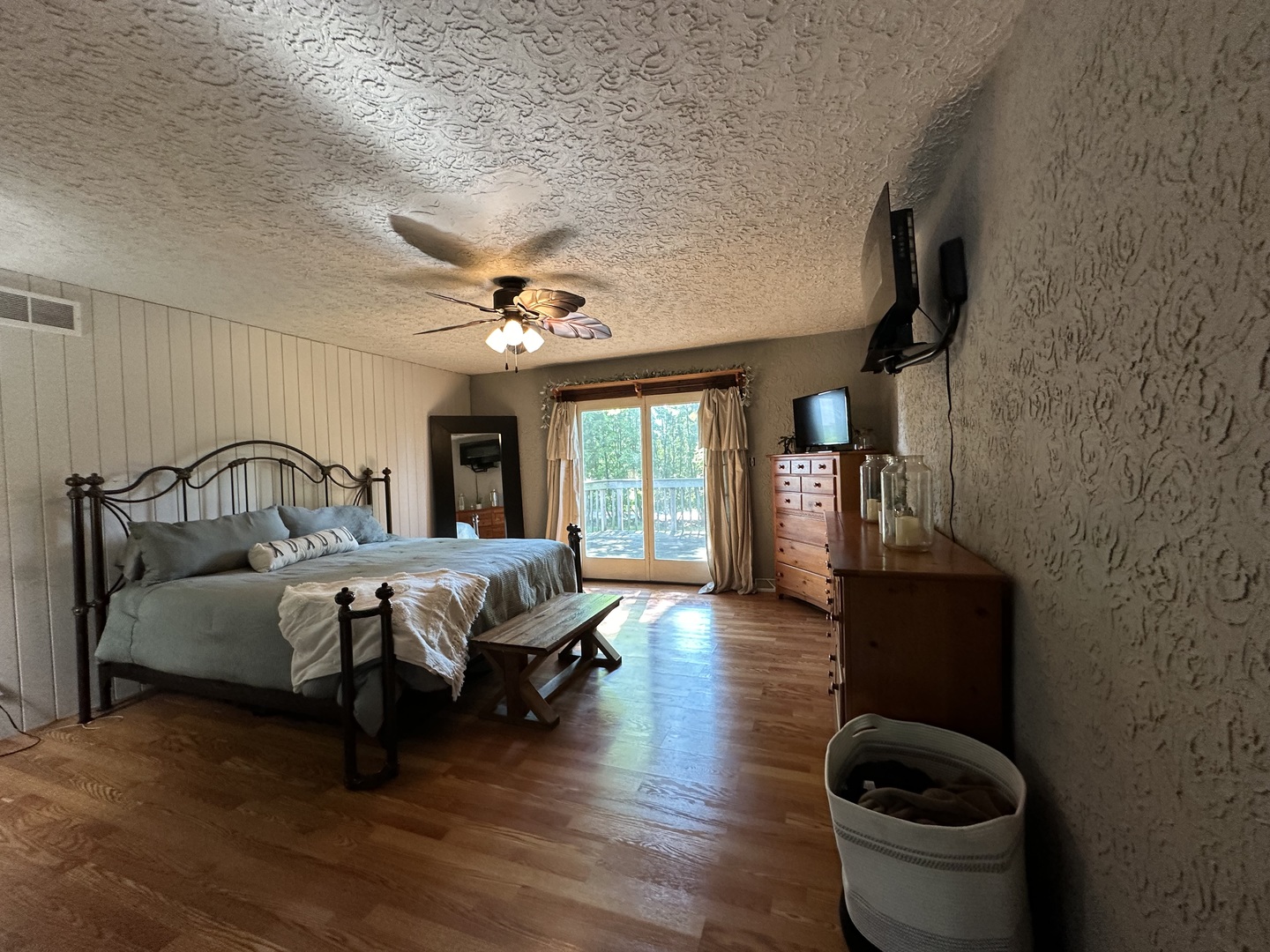 10600 Osage Road Prophetstown, IL 61277 - Photo 9 of 17 a bedroom with a bed and glass door