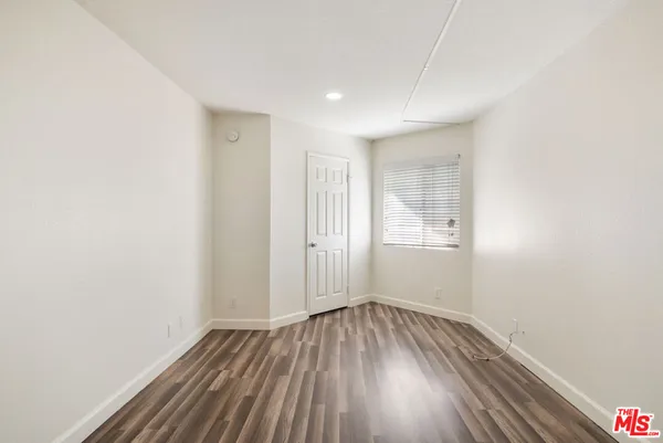 a view of a room with shelf on the wall