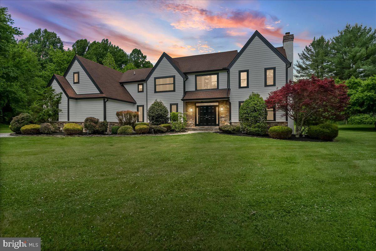 51 Ridings Way Chadds Ford, PA 19317 - Photo 13 of 57 a front view of a house with a garden