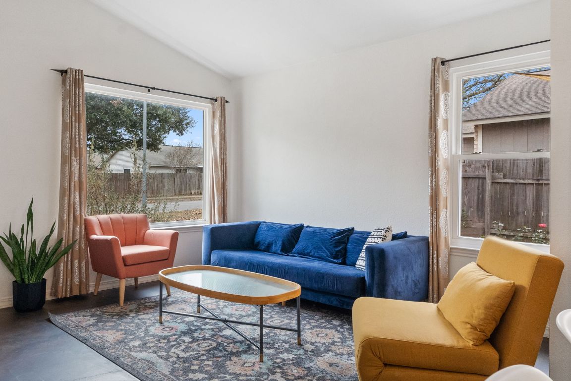 6016 Baton Rouge Drive Austin, TX 78727 - Photo 11 of 29 The living room has recently replaced picture windows that offer wonder views on the world along with energy efficiency