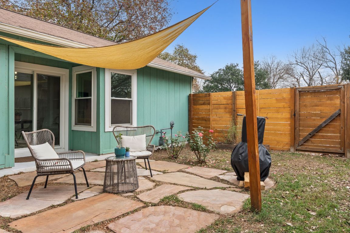 6016 Baton Rouge Drive Austin, TX 78727 - Photo 23 of 29 The flagstone patio makes the most of the large yard and has a handy gate for direct access to the front yard.