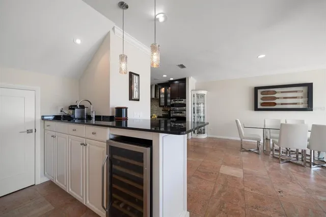 a kitchen with stainless steel appliances a refrigerator and cabinets