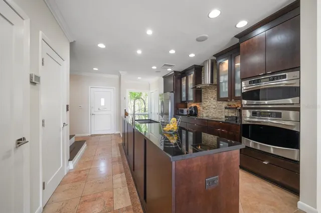 a kitchen with counter top space cabinets and stainless steel appliances