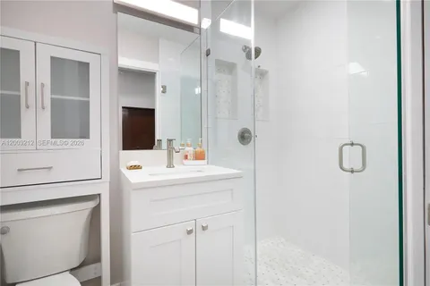 a bathroom with a sink and mirror