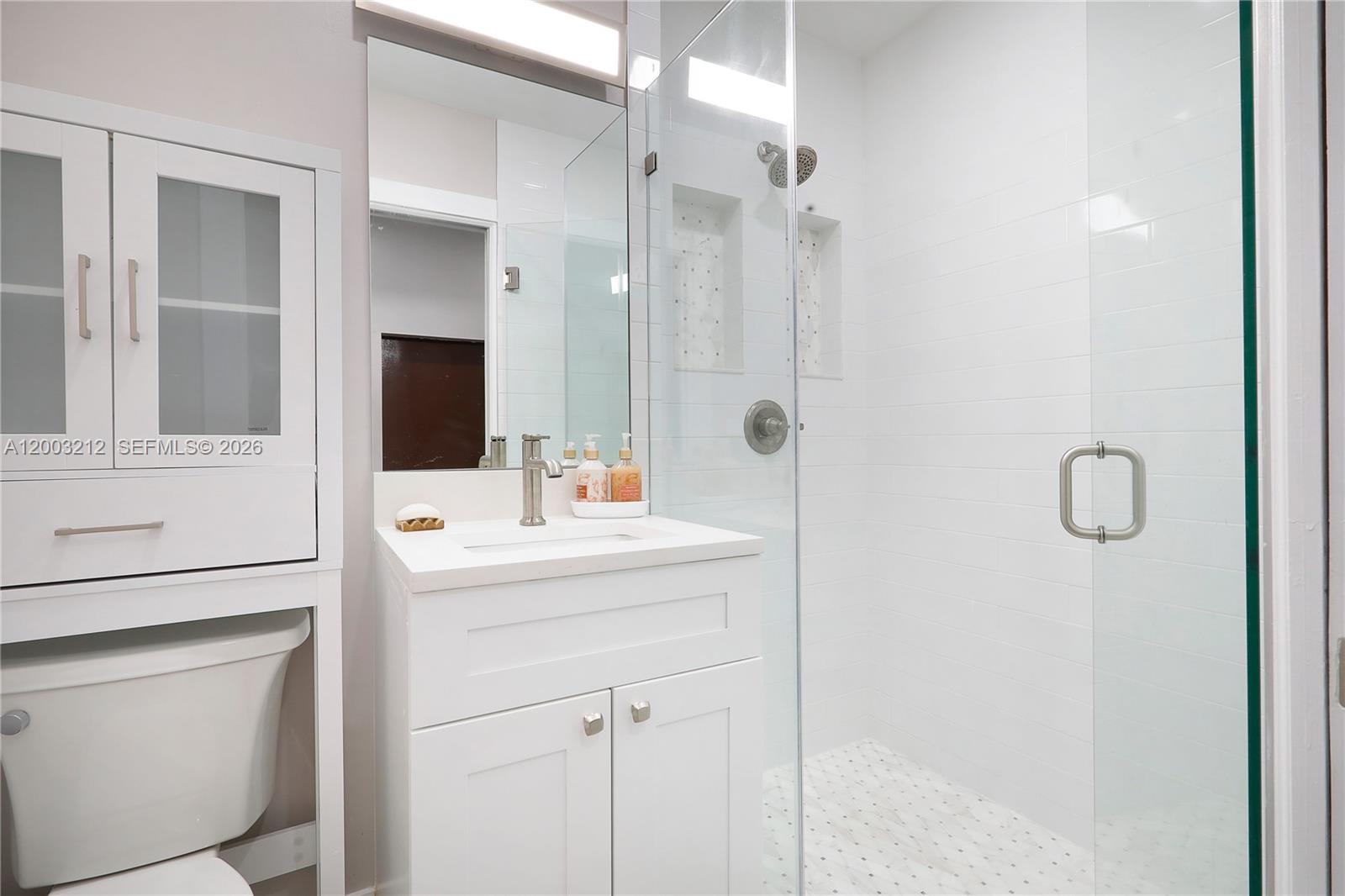 2368 Southwest 21st Street Miami, FL 33145 - Photo 2 of 8 a bathroom with a sink and mirror